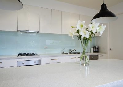 Flowers on contemporary kitchen bench